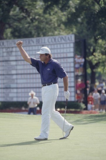 Fulton Allem celebrates in front of the leaderboard