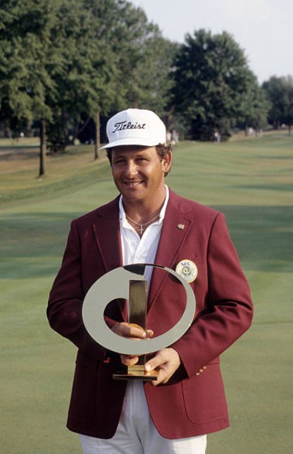 Fulton Allem posing with a tournament trophy